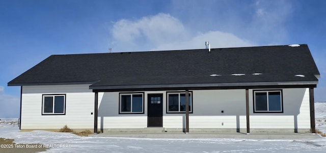 view of snow covered house