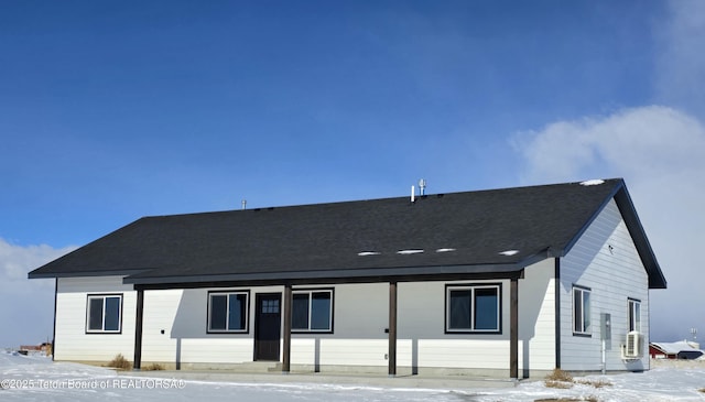 view of snow covered house