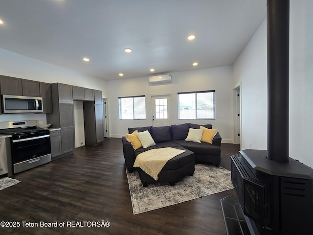 living area with dark wood-type flooring, recessed lighting, baseboards, and a wall mounted AC