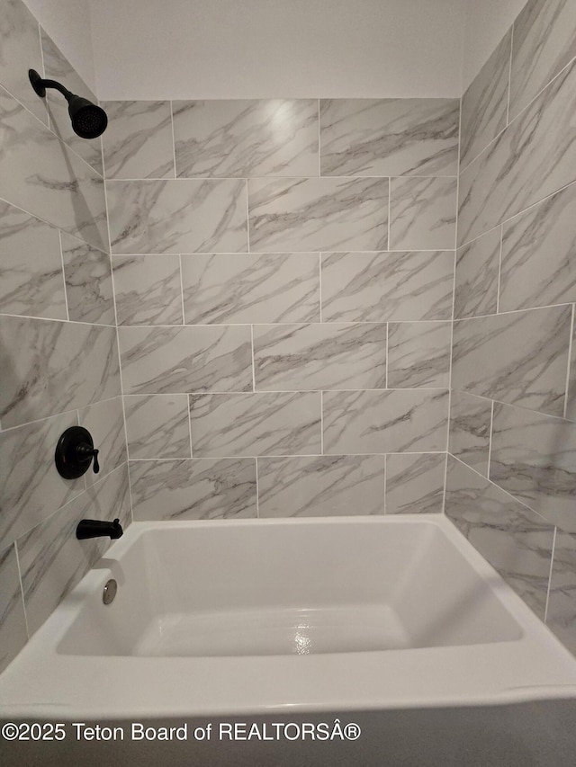 bathroom with shower / bathing tub combination