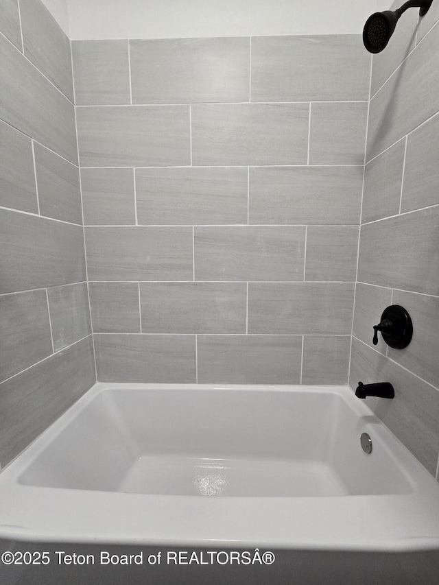 bathroom featuring bathing tub / shower combination