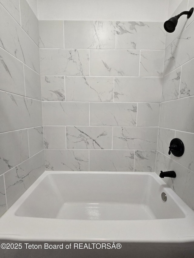 full bath featuring washtub / shower combination