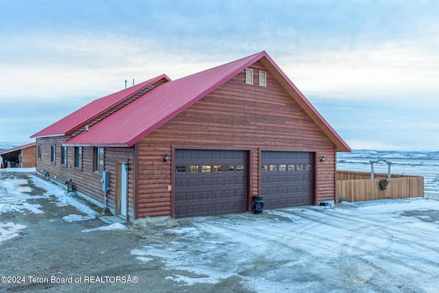 view of snow covered garage