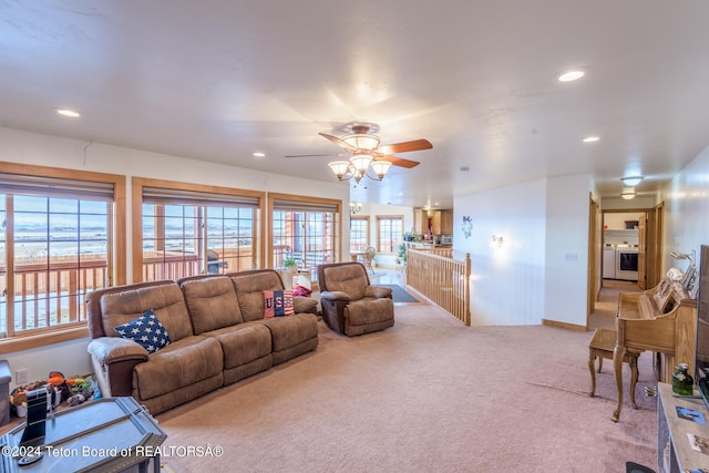 carpeted living room featuring ceiling fan