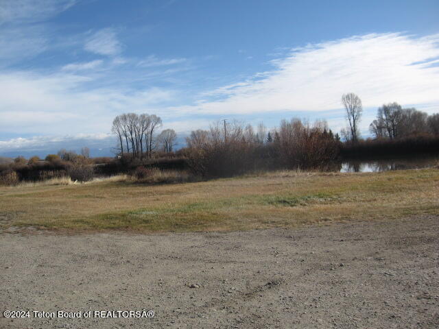 view of yard with a rural view