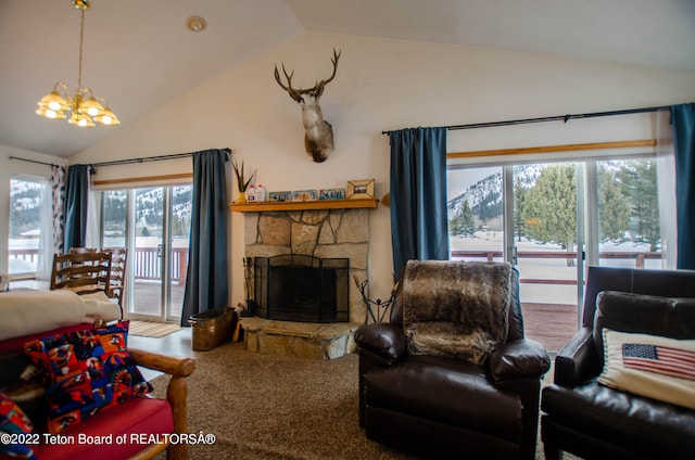 living room featuring a healthy amount of sunlight, a notable chandelier, a stone fireplace, and lofted ceiling