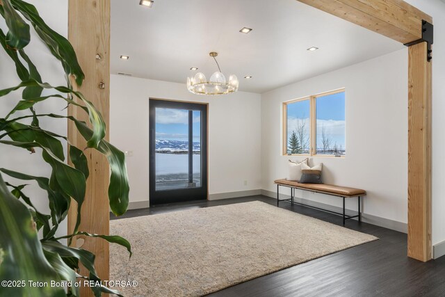 3139 Slinger Ct, Driggs, ID 83422 - entryway with baseboards, a chandelier, wood finished floors, and recessed lighting