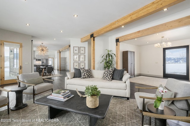3139 Slinger Ct, Driggs, ID 83422 - living area with a chandelier, recessed lighting, wood finished floors, beam ceiling, and a barn door