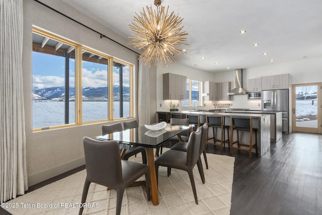 3139 Slinger Ct, Driggs, ID 83422 - dining room with a chandelier, recessed lighting, a water view, and light wood-type flooring