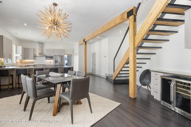 3139 Slinger Ct, Driggs, ID 83422 - dining room featuring wine cooler, stairway, a barn door, healthy amount of natural light, and recessed lighting
