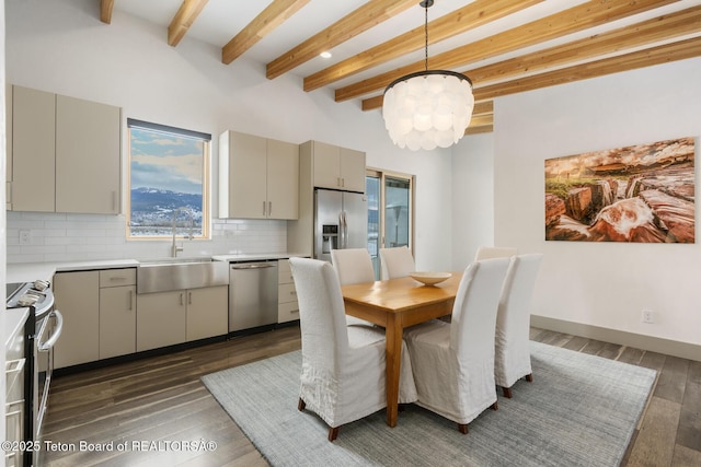 3139 Slinger Ct, Driggs, ID 83422 - dining room with a chandelier, beamed ceiling, and dark wood-style flooring
