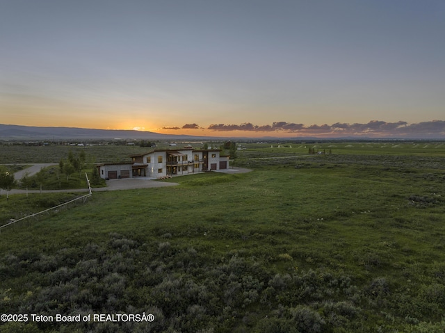 3139 Slinger Ct, Driggs, ID 83422 - view of front of property featuring a front yard, a view of countryside, and a mountain view