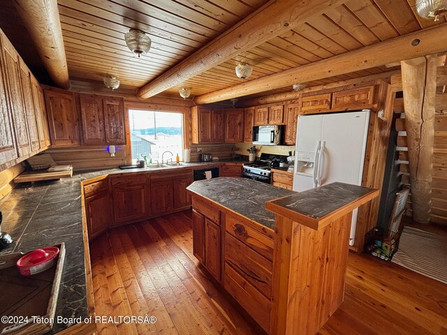 kitchen featuring a kitchen island, beam ceiling, wooden ceiling, white appliances, and dark hardwood / wood-style floors