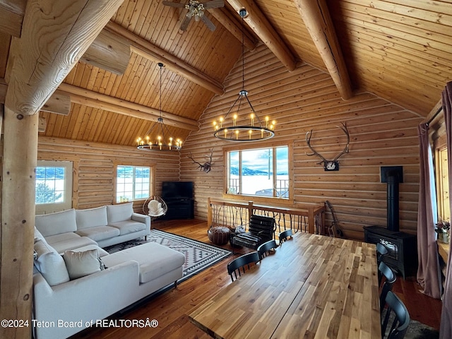 living room with wooden ceiling, ceiling fan with notable chandelier, wood-type flooring, and beamed ceiling