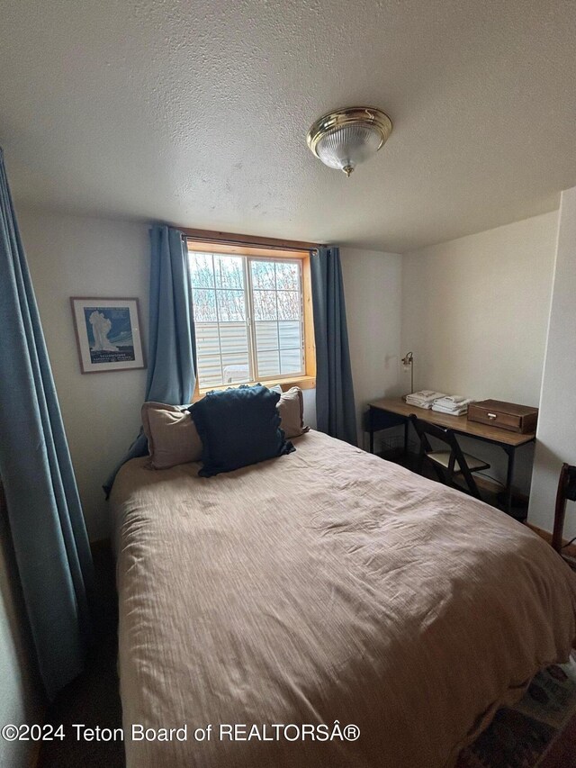 bedroom featuring a textured ceiling