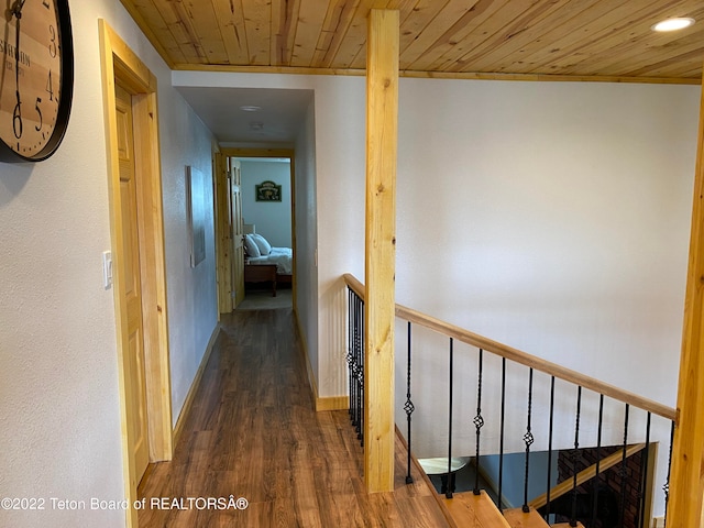 hall with wood ceiling and dark hardwood / wood-style floors