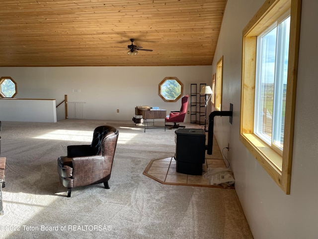 carpeted bedroom with vaulted ceiling, multiple windows, and wood ceiling