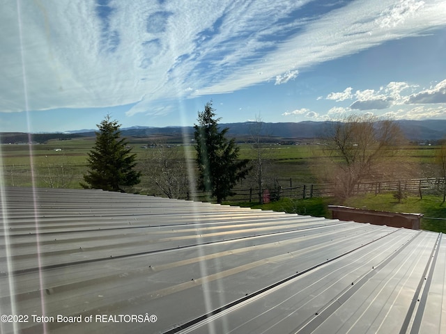 wooden deck featuring a rural view