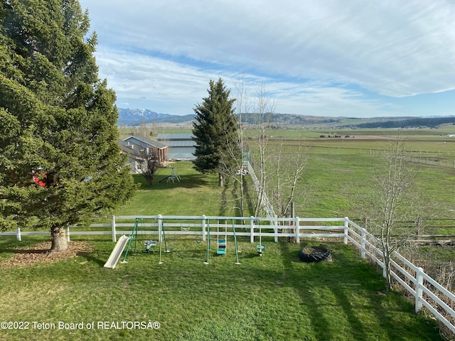 view of yard with a rural view