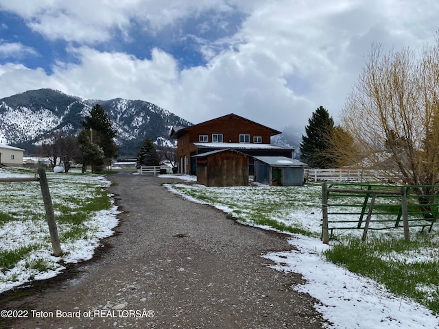 exterior space featuring a rural view and a mountain view