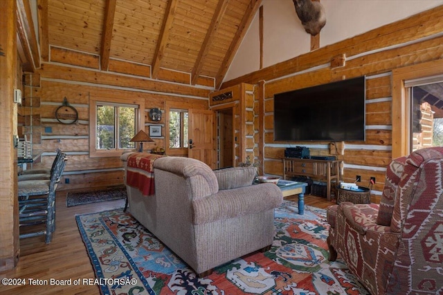 5 W Blair Rd, Alta, WY 83414 - living room featuring rustic walls, dark wood-type flooring, beam ceiling, wooden ceiling, and wooden walls