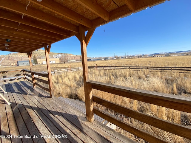 wooden terrace with a rural view