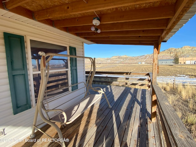 wooden terrace with a mountain view