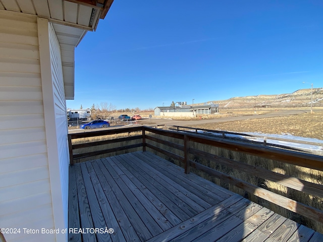 wooden deck featuring a mountain view