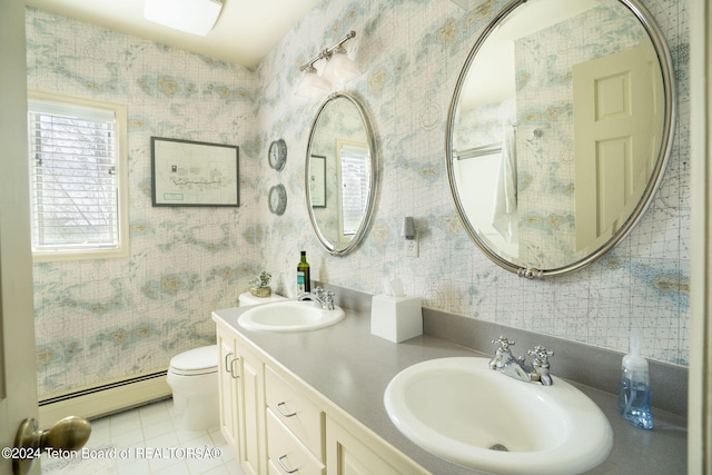 bathroom with baseboard heating, tile flooring, toilet, and dual vanity