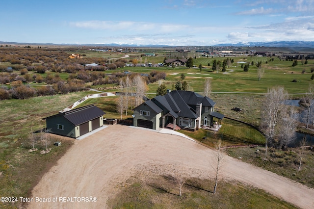 birds eye view of property with a rural view