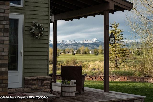 view of patio with a deck with mountain view