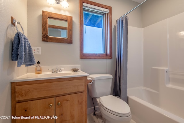 full bathroom featuring toilet, oversized vanity, and shower / bath combo with shower curtain