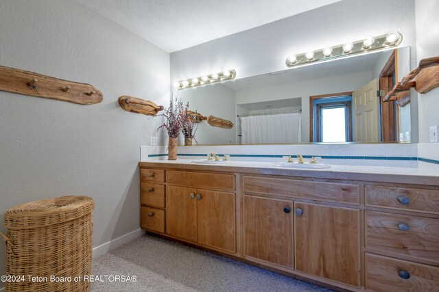 bathroom with double sink and large vanity