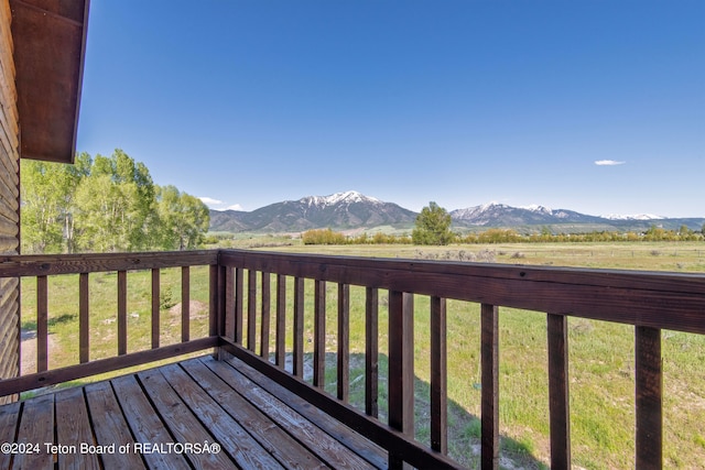 wooden terrace with a mountain view