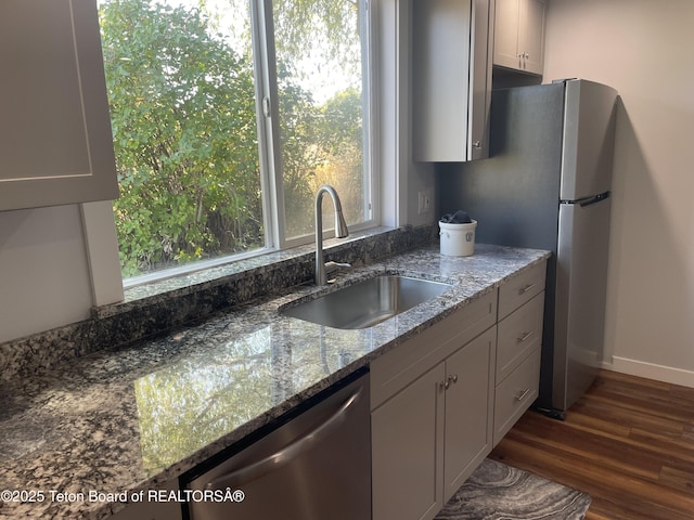 4193 Old Irwin Rd, Irwin, ID 83428 - kitchen featuring a sink, stone countertops, appliances with stainless steel finishes, dark wood finished floors, and baseboards