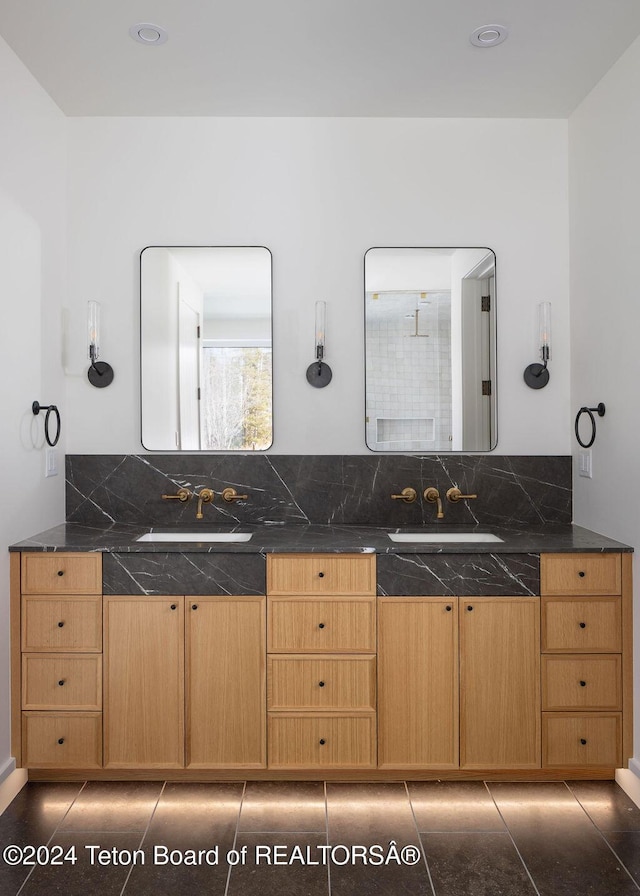 bathroom featuring double vanity and a sink