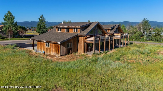 back of property featuring a mountain view