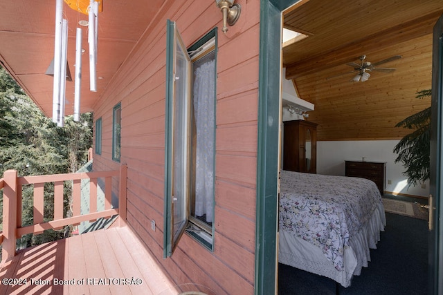 exterior space featuring wooden ceiling, lofted ceiling, wood-type flooring, and ceiling fan