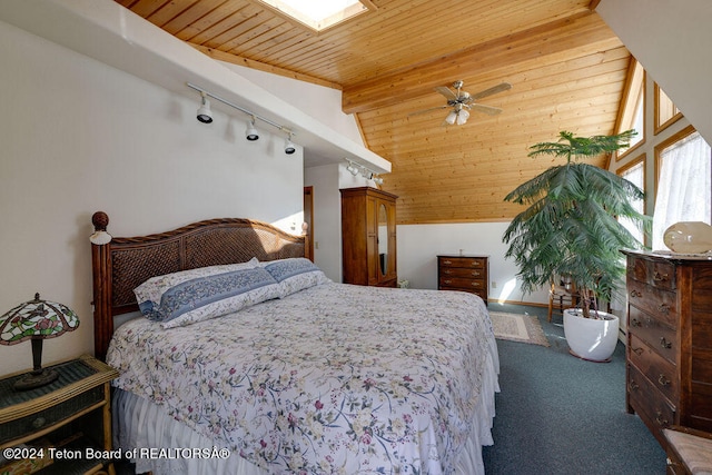 bedroom featuring wooden ceiling, carpet floors, vaulted ceiling with beams, and rail lighting