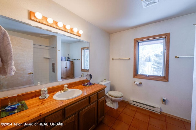 bathroom with tile floors, a baseboard radiator, vanity, and toilet