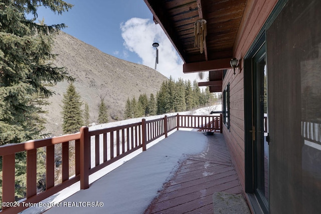 wooden terrace with a mountain view