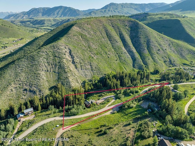 drone / aerial view featuring a mountain view