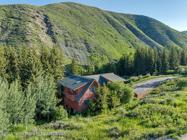 property view of mountains with a wooded view