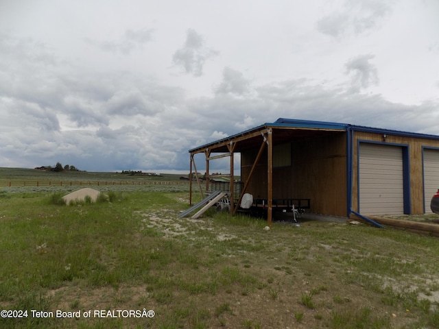 view of outdoor structure featuring a rural view