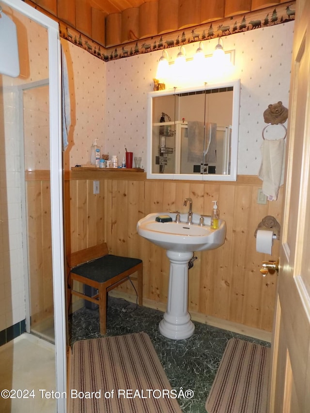 bathroom featuring wooden walls