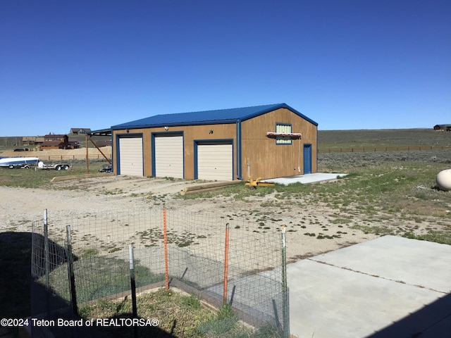 view of outbuilding featuring a garage