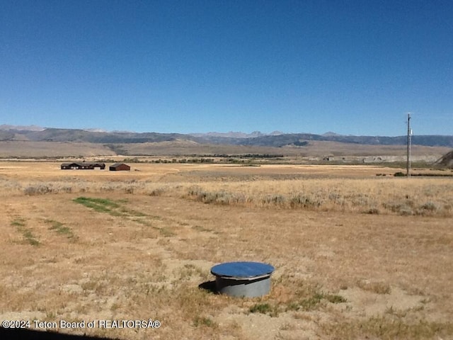 mountain view featuring a rural view