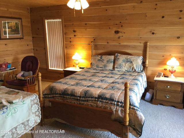 bedroom with wood walls