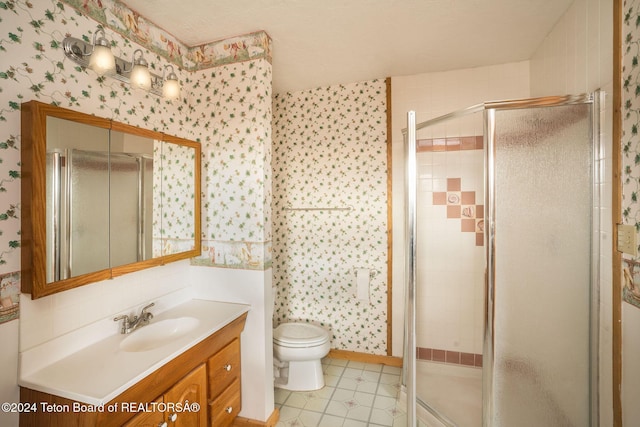 6 Black Bear Rd, Pinedale, WY 82941 - bathroom with wallpapered walls, vanity, a stall shower, and tile patterned flooring