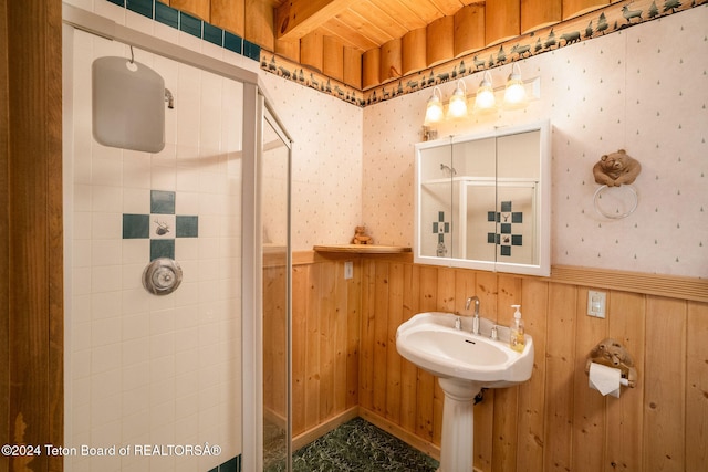 bathroom with a shower, wood ceiling, and wood walls